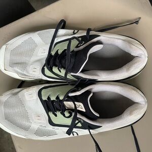 On Running Sneakers in White and Black with Green Accents